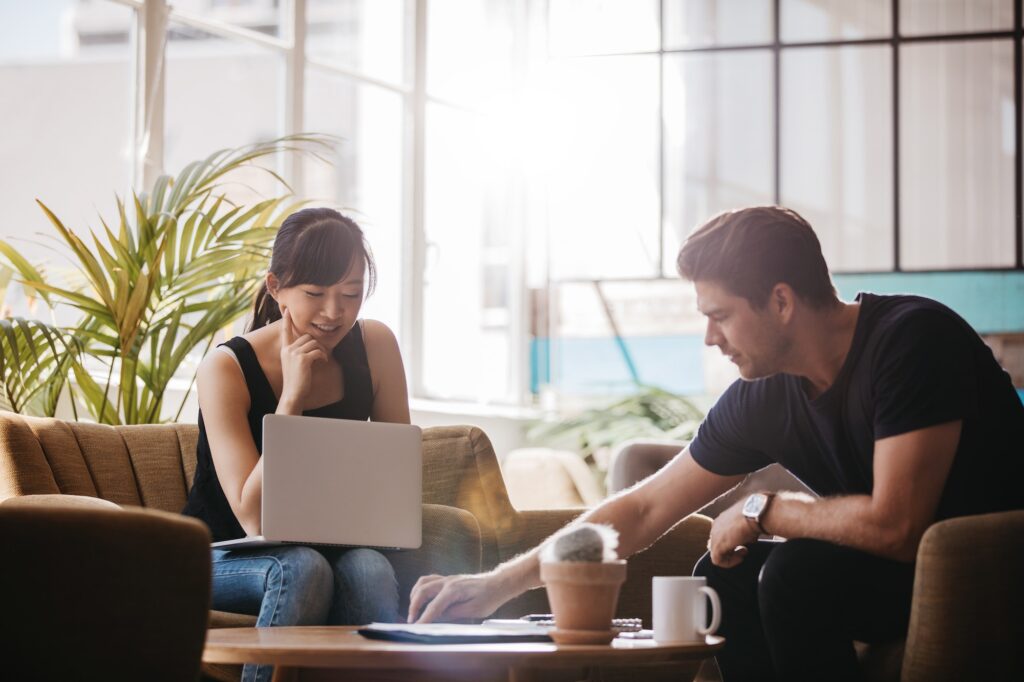 Two Support Workers sitting and talking together